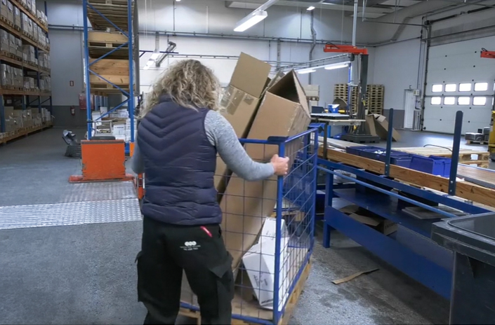 Warehouse worker handling waste